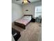 Cozy bedroom featuring a comfortable bed and natural lighting from the window at 4632 Chatterton Way, Riverview, FL 33578