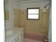 Well-lit bathroom with a vanity, window, and a shower-tub combination at 4851 W Gandy Blvd # B5L19, Tampa, FL 33611