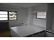 Cozy bedroom featuring built-in storage, shelving, and neutral décor at 4851 W Gandy Blvd # B5L19, Tampa, FL 33611