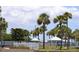 Community area featuring tropical palm trees, picnic gazebos, and inviting walkways showcasing a vibrant outdoor space at 4851 W Gandy Blvd # B5L19, Tampa, FL 33611