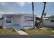 Charming single-story home with a well-maintained lawn and carport; perfect for easy living at 4851 W Gandy Blvd # B5L19, Tampa, FL 33611
