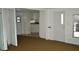 Open living space with a view into the kitchen and access to the front entrance at 4851 W Gandy Blvd # B5L19, Tampa, FL 33611