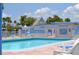 Bright pool featuring a shallow end and clear water, with nearby signage about pool rules and a no diving warning at 4851 W Gandy Blvd # B5L19, Tampa, FL 33611