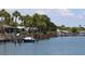Scenic waterfront view with boat docks and lush palm trees, offering relaxing ambiance at 4851 W Gandy Blvd # B5L19, Tampa, FL 33611