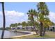 Charming waterfront homes along a brick-lined walkway, offering serene views and a relaxing atmosphere amid palm trees at 4851 W Gandy Blvd # B5L19, Tampa, FL 33611