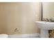 Powder room featuring a pedestal sink and tiled floors at 4896 San Martino Dr, Wesley Chapel, FL 33543