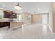 Open concept kitchen with island, stainless steel appliances, and lots of natural light at 4896 San Martino Dr, Wesley Chapel, FL 33543