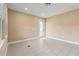 Bright room with recessed lighting, tile floors, and door to the outside at 4896 San Martino Dr, Wesley Chapel, FL 33543
