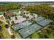 Aerial view of community tennis courts, clubhouse, and pool offers resort-style living at 4896 San Martino Dr, Wesley Chapel, FL 33543