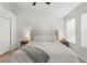 Spacious main bedroom featuring wood flooring, white walls, and a ceiling fan at 5168 6Th N Way, St Petersburg, FL 33703