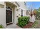 Inviting front entrance features a wreath-adorned door, manicured bushes, and a welcoming 'hello' doormat at 5168 6Th N Way, St Petersburg, FL 33703