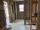 Bathroom needing renovation with tile floors, a small window, exposed walls, and rough-in plumbing at 525 Crystal Dr, Madeira Beach, FL 33708
