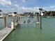 Private boat lift providing convenient access to the canal, enhancing waterfront living at 525 Crystal Dr, Madeira Beach, FL 33708