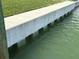 Concrete seawall along canal, offering durability and protection for waterfront property at 525 Crystal Dr, Madeira Beach, FL 33708