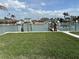 Beautiful waterfront property featuring a well-kept lawn and a private canal with convenient boat docking facilities at 525 Crystal Dr, Madeira Beach, FL 33708