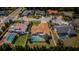 Aerial view of the property showcasing the sparkling pool, lush landscaping, and desirable neighborhood at 5342 Sagamore Ct, New Port Richey, FL 34655