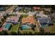 Aerial view showcases this beautiful home nestled in a lush neighborhood with a pool in the backyard at 5342 Sagamore Ct, New Port Richey, FL 34655