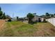 Spacious backyard with well-kept lawn and screened-in pool area, great for outdoor activities at 5342 Sagamore Ct, New Port Richey, FL 34655