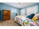Comfortable bedroom with carpet, ceiling fan, double closet, and bright walls at 5342 Sagamore Ct, New Port Richey, FL 34655