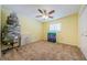 Cozy bedroom with a ceiling fan, carpeted floor, and window with natural light at 5342 Sagamore Ct, New Port Richey, FL 34655