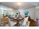 Elegant dining room featuring a large mirrored wall and dining table at 5342 Sagamore Ct, New Port Richey, FL 34655