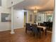 Spacious dining room with laminate flooring, a stylish light fixture, and neutral decor at 5342 Sagamore Ct, New Port Richey, FL 34655