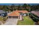 A well-maintained single Gathering home with an attached two car garage and manicured lawn at 5342 Sagamore Ct, New Port Richey, FL 34655