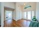 Inviting foyer with hardwood floors, high ceilings, a stylish light fixture and decorative glass front door at 5342 Sagamore Ct, New Port Richey, FL 34655
