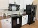 Well-equipped kitchen featuring stainless steel appliances, granite countertops, and white cabinetry for a modern look at 5342 Sagamore Ct, New Port Richey, FL 34655