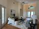 Open-concept living area with high ceilings, a ceiling fan, and a view of the front entrance at 5342 Sagamore Ct, New Port Richey, FL 34655
