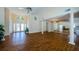 Open living area with wood floors, high ceilings, and natural light, flowing into adjacent spaces with ease at 5342 Sagamore Ct, New Port Richey, FL 34655
