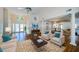 Open-concept living room with hardwood floors, and neutral colored furniture at 5342 Sagamore Ct, New Port Richey, FL 34655
