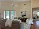 Inviting living room with stylish decor, a comfortable sofa, and a view of the backyard pool area at 5342 Sagamore Ct, New Port Richey, FL 34655
