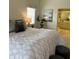 This main bedroom has light walls and a comfortable bed, as well as an open entry to the main bathroom at 5342 Sagamore Ct, New Port Richey, FL 34655
