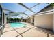 Stunning backyard oasis with a screened pool, perfect for entertaining or relaxing by the water at 5342 Sagamore Ct, New Port Richey, FL 34655
