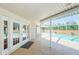 Covered patio provides access to the screened pool, seamlessly blending indoor and outdoor living at 5342 Sagamore Ct, New Port Richey, FL 34655