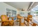 Charming outdoor patio with a ceiling fan and ample seating, overlooking the sparkling pool at 5342 Sagamore Ct, New Port Richey, FL 34655
