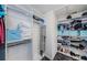 Walk-in closet with customized storage solutions and a neutral carpet at 5342 Sagamore Ct, New Port Richey, FL 34655