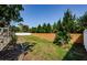 Fenced yard with a well-maintained lawn, landscaping, and privacy wall for a serene outdoor space at 5342 Sagamore Ct, New Port Richey, FL 34655