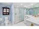 Updated bathroom features a glass shower, white cabinets, and modern fixtures at 5850 Gasparilla Rd # M5, Boca Grande, FL 33921