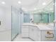 Updated bathroom featuring a glass shower, white cabinets, and modern fixtures at 5850 Gasparilla Rd # M5, Boca Grande, FL 33921