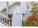 Condominium entrance with stairs and a well-maintained exterior, showcasing inviting access at 5850 Gasparilla Rd # M5, Boca Grande, FL 33921