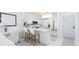Bright, updated kitchen features modern appliances, sleek countertops, and stylish pendant lighting at 5850 Gasparilla Rd # M5, Boca Grande, FL 33921