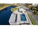 Aerial view of a community pool, adjacent to the water at 5850 Gasparilla Rd # M5, Boca Grande, FL 33921