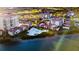 Stunning aerial view of community with multiple pools, buildings, and beautiful landscaping at 6269 Palma Del Mar S Blvd # 111, St Petersburg, FL 33715