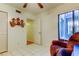Bright bedroom featuring tile flooring, a ceiling fan, and an open doorway at 6269 Palma Del Mar S Blvd # 111, St Petersburg, FL 33715