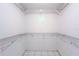 Spacious walk-in closet with custom shelving, offering ample storage space at 6269 Palma Del Mar S Blvd # 111, St Petersburg, FL 33715