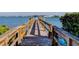 Charming wooden dock providing access to the water for recreation and relaxation at 6269 Palma Del Mar S Blvd # 111, St Petersburg, FL 33715