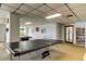 Spacious game room with ping pong, pool table, and bookcase at 6269 Palma Del Mar S Blvd # 111, St Petersburg, FL 33715