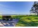 Green community park with bench seating and views of bay at 6269 Palma Del Mar S Blvd # 111, St Petersburg, FL 33715